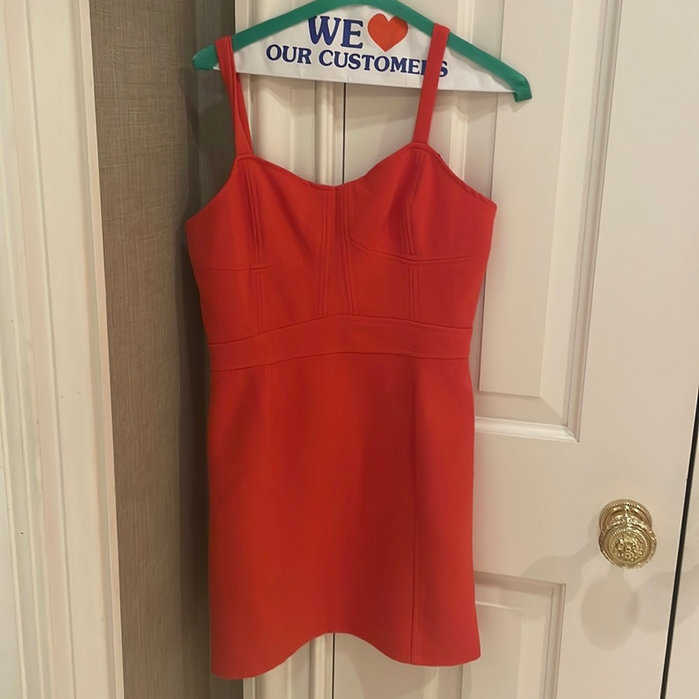 Bright orange tank dress with cut outs on the back